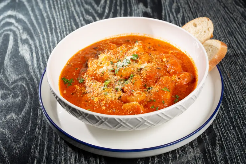 Gnocchi arrabbiata in tomato, garlic and basil sauce with bread