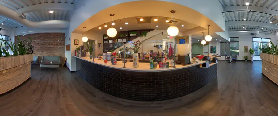 Counter, brick wall and lounge seating