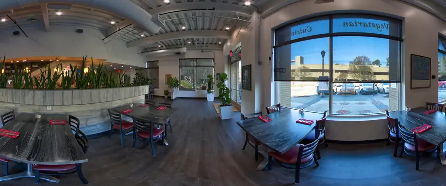 Sage dining room set with tables, ready for a private event